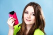 © Voyagerix - Happy girl with mobile phone in pink cover