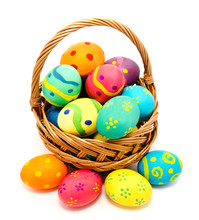 Colorful Handmade Easter Eggs In The Basket Isolated