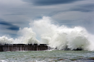 Poster - big waves breaking on breakwater