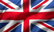 Leinwandbild Motiv Flag of United Kingdom, Great Britain blowing in the wind. Full page British flying flag. Union Jack flag. 3D illustration.
