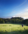 © vladis_studio - tourist walking on a footpath across the field