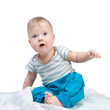 © golovianko - Cute little boy sitting on white blanket isolated on white