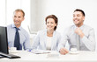 © Syda Productions - business team discussing something in office