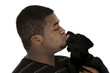 © sixdays - black model being licked by his labrador puppy dog