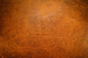 brown leather textured background with side light.