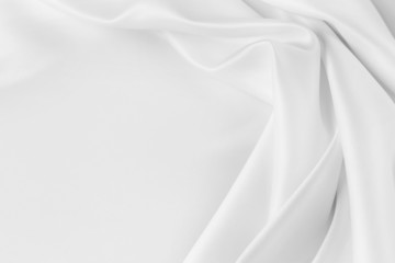 White silk fabric rippled texture background. Copy space