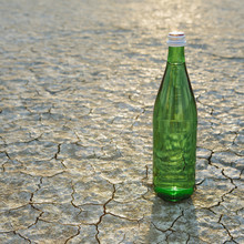 The Landscape Of The Black Rock Desert In Nevada. A Bottle Of Water. Filtered Mineral Water. 