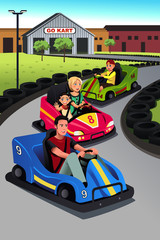 Wall Mural - Family playing go-kart