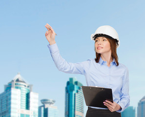 Sticker - smiling businesswoman in helmet with clipboard