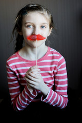 Wall Mural - Beautiful little girl with lollipop