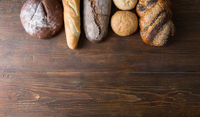 Fresh baked bread at wooden table