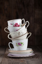 Stack Of A Variety Of Flower Tea Cups..