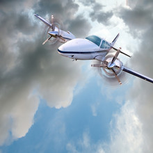 Light Twin-engined Piston Aircraft In Flight