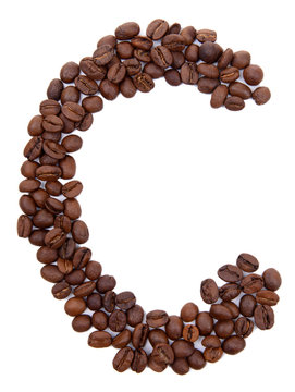 Alphabet from coffee beans isolated on white