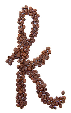 Alphabet from coffee beans isolated on white
