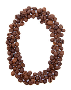 Alphabet from coffee beans isolated on white