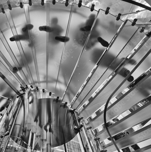 Naklejka - mata magnetyczna na lodówkę People feet on a transparent staircase, upward view