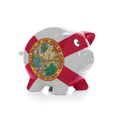 Piggy bank with flag coating over it - State of Florida