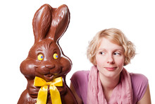 Chocolate Easter Bunny Looking At A Blond Girl