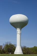 A Water Tower In The Deep Blue Sky