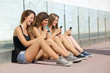 Group of teenager girls smiling happy texting on the smart phone
