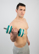 © Maria Vazquez - Muscular young man with dumbbells