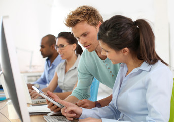 Wall Mural - Group of young adults in business training