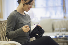 Woman Relaxing At Home With Knitting