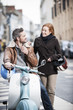 © jackfrog - handsome couple riding a trendy scooter