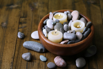 Poster - Composition with spa stones, candles on wooden background