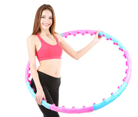 Wall Mural - Woman doing exercises with hula hoop isolated on white