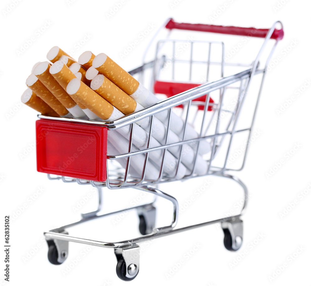 Cigarettes in shopping cart isolated on white