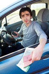 Young man presenting papers at a routine check