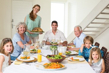 Family having meal at dining table