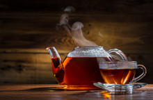 Glass Teapot And Mug On The Wooden Background