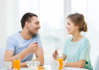 Sticker - smiling couple having breakfast at home