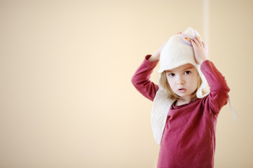 Wall Mural - Adorable little girl wearing funny hat