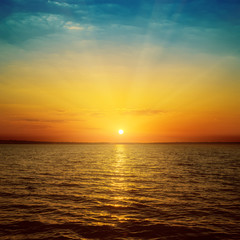 Wall Mural - good orange sunset over sea