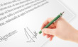 © ra2 studio - Hand writing personal signature on a paper form