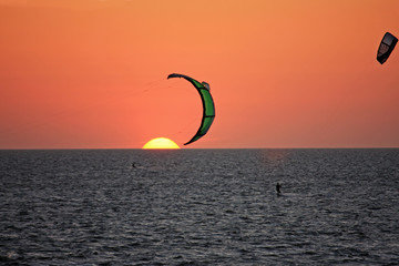 Wall Mural - kitesurfers at sunset