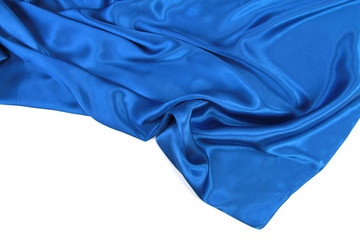 Blue wavy silk fabric on white background