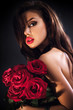 Beautiful female holding red roses bouquet, valentines day.