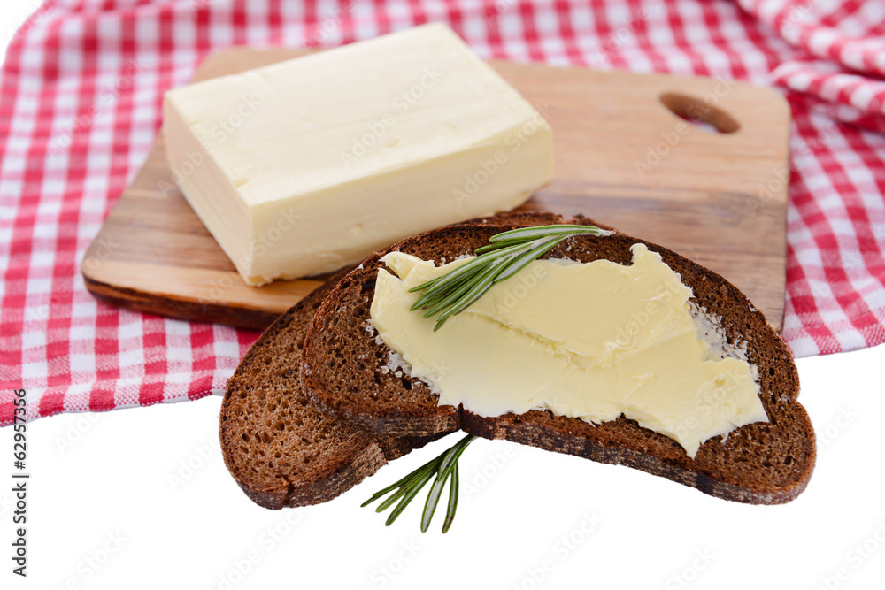Slice of rye bread with butter, isolated on white