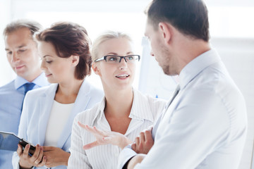 Poster - man and woman having discussion in office