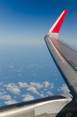 Wing of the plane on sky backgroun