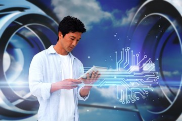 Poster - Casual man using tablet with circuit board