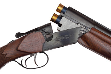 Opened double-barrelled hunting loaded gun closeup isolated