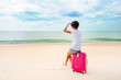 © Valeriy Lebedev - Woman with a suitcase on the beach