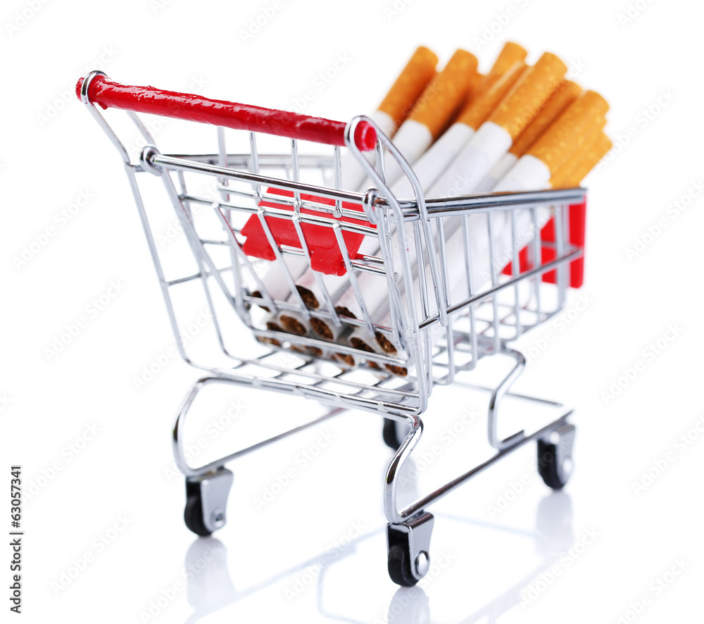 Cigarettes in shopping cart isolated on white