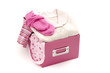© iulianvalentin - Close up of a box full with baby pink clean clothes isolated